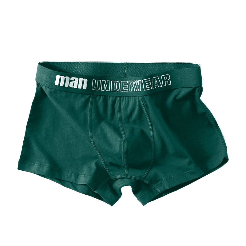 Solid color green cotton male boxers with 'man' label, designed for comfort and style, perfect for everyday wear.